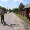 Не дорога, а головная боль. Жители деревень Синявская Слобода и Романы жалуются на состояние дорог